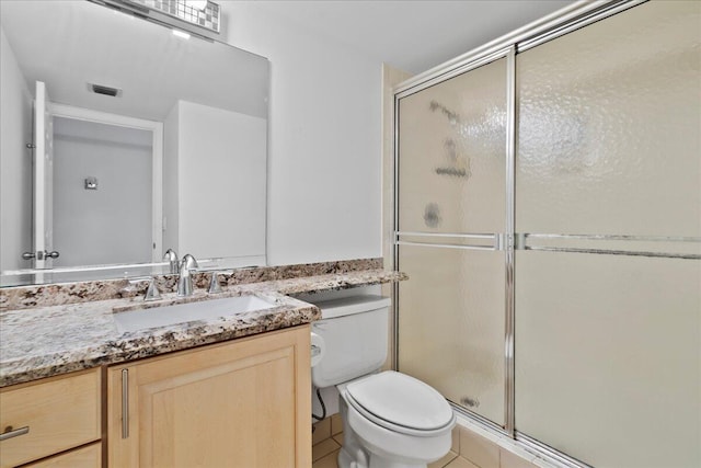 1640 Twelve Oaks Way Unit 205, North Palm Beach, FL 33408 - full bath with vanity, toilet, tile patterned floors, visible vents, and a stall shower