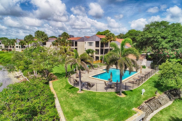 1640 Twelve Oaks Way Unit 205, North Palm Beach, FL 33408 - community pool with a lawn and fence