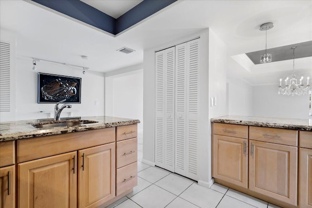 1640 Twelve Oaks Way Unit 205, North Palm Beach, FL 33408 - interior space featuring visible vents, light tile patterned flooring, a raised ceiling, a sink, and a notable chandelier