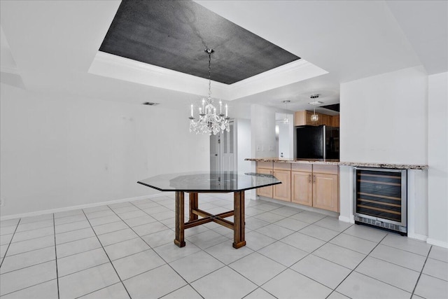 1640 Twelve Oaks Way Unit 205, North Palm Beach, FL 33408 - unfurnished dining area featuring visible vents, wine cooler, baseboards, a tray ceiling, and a notable chandelier