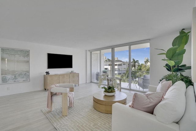 354 Chilean Ave Unit 4D, Palm Beach, FL 33480 - living area featuring floor to ceiling windows and wood finished floors