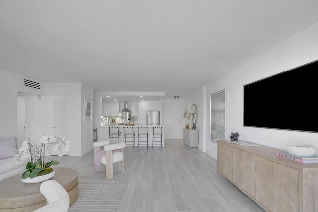 354 Chilean Ave Unit 4D, Palm Beach, FL 33480 - living area featuring light wood-type flooring and baseboards