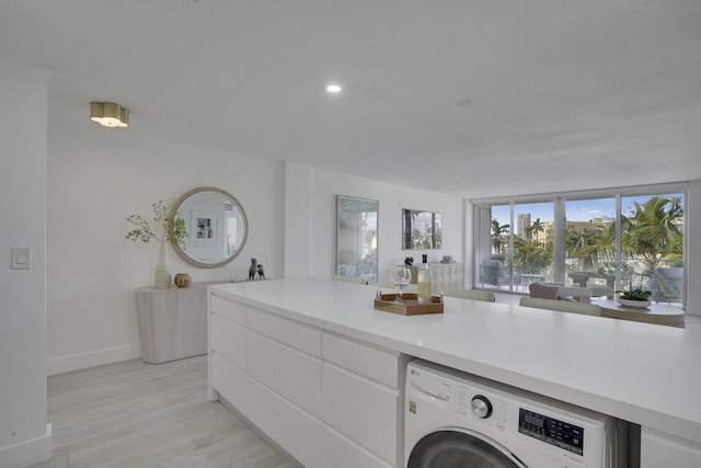 354 Chilean Ave Unit 4D, Palm Beach, FL 33480 - laundry area with washer / dryer, light wood-style floors, baseboards, and recessed lighting