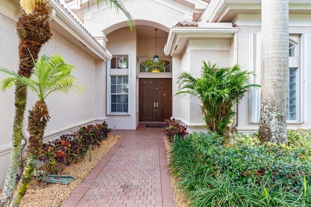 8837 Woodgrove Ridge Ct, Boynton Beach, FL 33473 - entrance to property with stucco siding