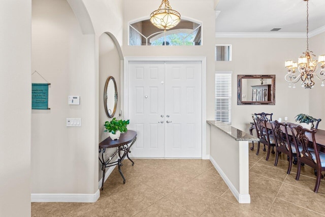 8837 Woodgrove Ridge Ct, Boynton Beach, FL 33473 - entryway featuring baseboards, light tile patterned floors, and a notable chandelier