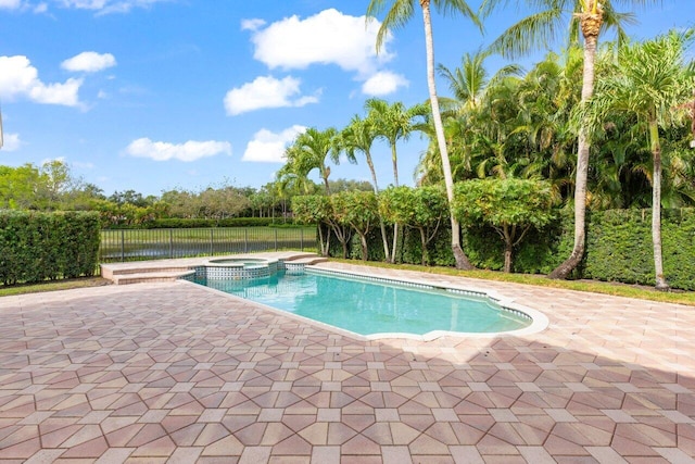 8837 Woodgrove Ridge Ct, Boynton Beach, FL 33473 - view of pool featuring a patio, a pool with connected hot tub, fence, and a water view