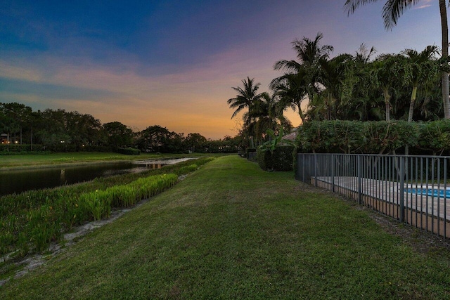 8837 Woodgrove Ridge Ct, Boynton Beach, FL 33473 - surrounding community with a yard, a water view, fence, and a pool