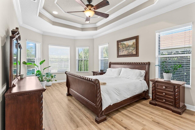 8837 Woodgrove Ridge Ct, Boynton Beach, FL 33473 - bedroom featuring light wood-style floors, baseboards, crown molding, and a tray ceiling