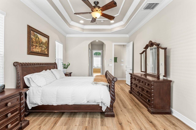 8837 Woodgrove Ridge Ct, Boynton Beach, FL 33473 - bedroom featuring light wood-style floors, baseboards, crown molding, and a tray ceiling