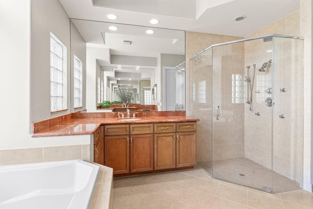 8837 Woodgrove Ridge Ct, Boynton Beach, FL 33473 - full bath with tile patterned flooring, vanity, recessed lighting, a garden tub, and a stall shower