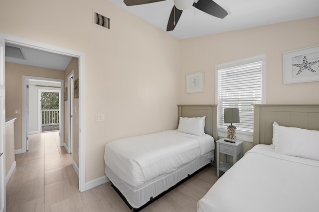 bedroom with visible vents, baseboards, and ceiling fan