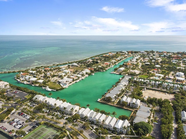 drone / aerial view featuring a water view and a residential view