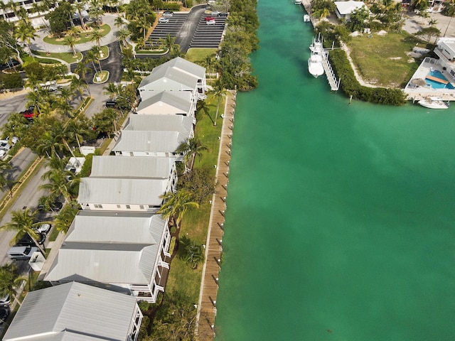 birds eye view of property featuring a water view and a residential view
