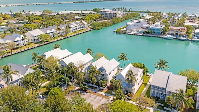 bird's eye view with a water view and a residential view