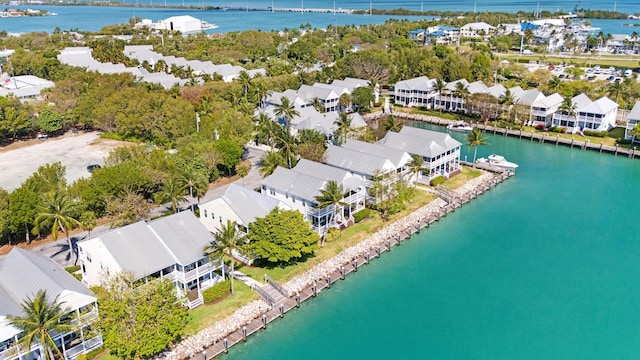 bird's eye view featuring a water view and a residential view