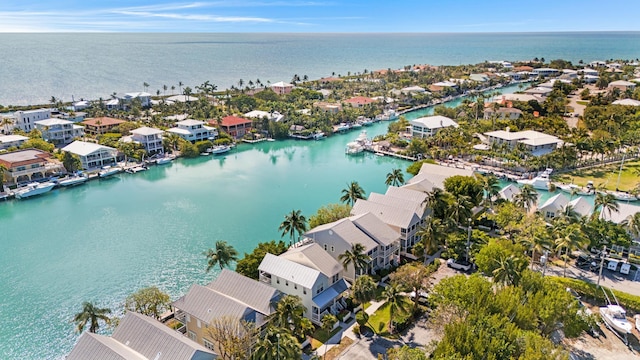 birds eye view of property featuring a residential view and a water view