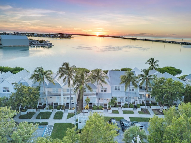 bird's eye view with a water view and a residential view