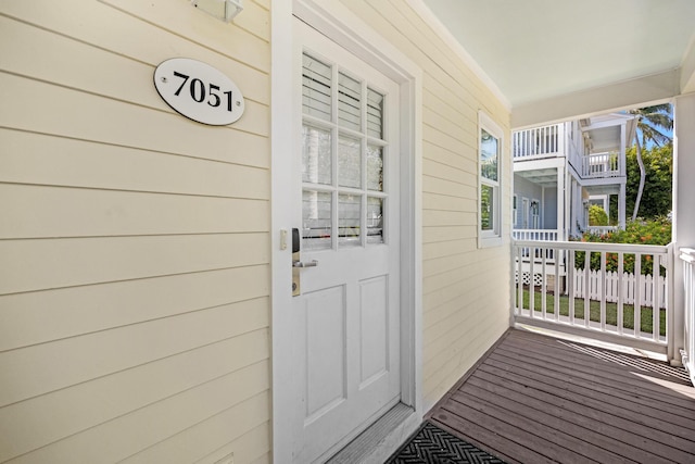 doorway to property featuring covered porch