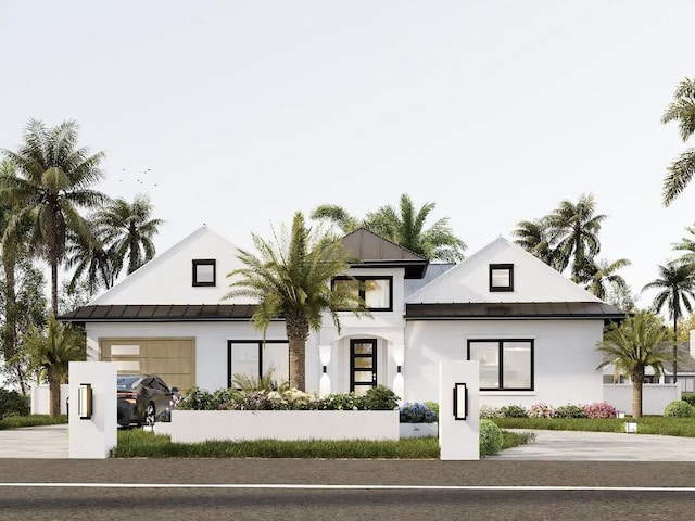 217 Kings Lynn, Delray Beach, FL 33444 - view of front of property featuring stucco siding, a standing seam roof, metal roof, an attached garage, and driveway