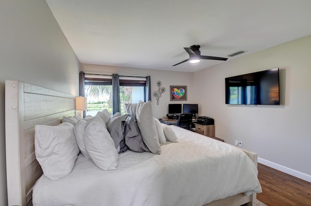 bedroom featuring ceiling fan, baseboards, visible vents, and wood finished floors