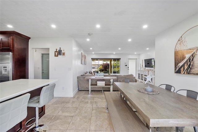 dining space with baseboards and recessed lighting