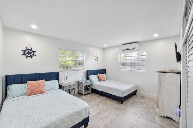 bedroom featuring light tile patterned floors, baseboards, a wall unit AC, and recessed lighting