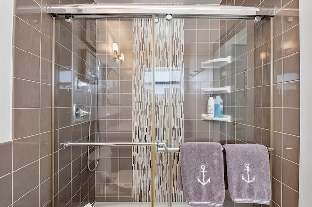 bathroom featuring a shower stall