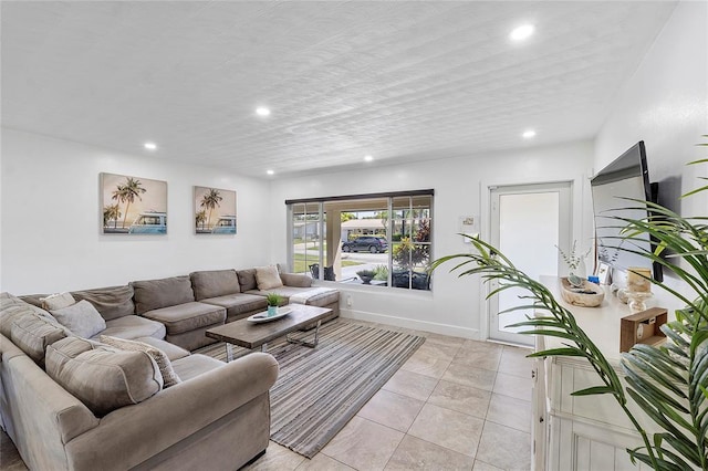 living area with light tile patterned floors and recessed lighting