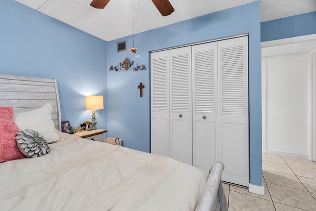 712 Sunny Pine Way Unit D1, Greenacres, FL 33415 - bedroom with light tile patterned flooring, a ceiling fan, visible vents, and a closet
