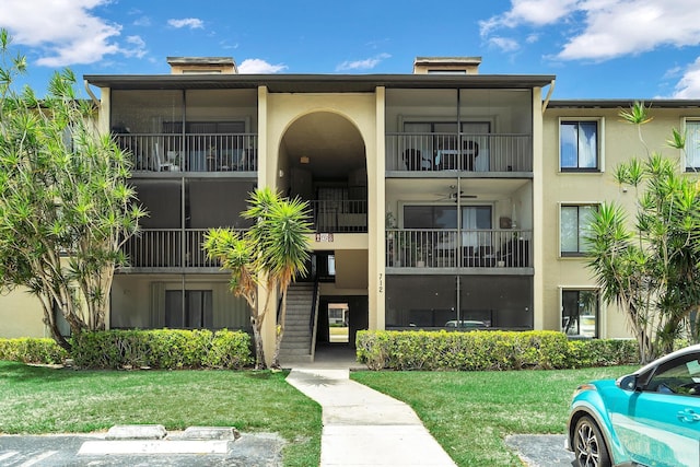 712 Sunny Pine Way Unit D1, Greenacres, FL 33415 - view of building exterior with uncovered parking