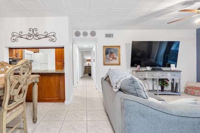 712 Sunny Pine Way Unit D1, Greenacres, FL 33415 - living room featuring visible vents, a ceiling fan, light tile patterned floors, and an ornate ceiling