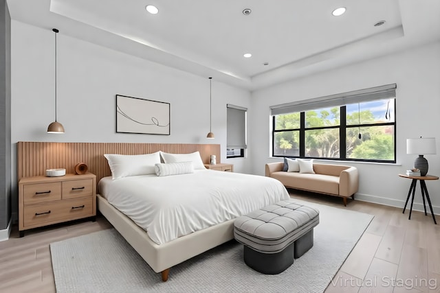 13158 Artisan Cir, Palm Beach Gardens, FL 33418 - bedroom with a tray ceiling, recessed lighting, and light wood-style flooring