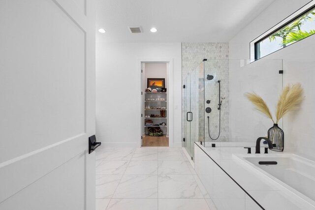 13158 Artisan Cir, Palm Beach Gardens, FL 33418 - bathroom featuring a stall shower, a spacious closet, marble finish floors, and recessed lighting
