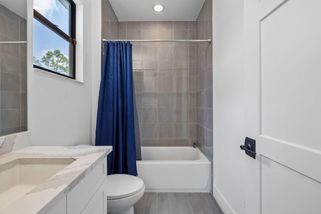 13158 Artisan Cir, Palm Beach Gardens, FL 33418 - full bath featuring vanity, toilet, shower / tub combo, wood finished floors, and recessed lighting