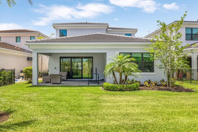 13158 Artisan Cir, Palm Beach Gardens, FL 33418 - rear view of house featuring an outdoor living space, a tile roof, and stucco siding