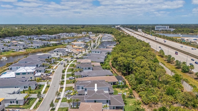 13158 Artisan Cir, Palm Beach Gardens, FL 33418 - aerial perspective of suburban area featuring a major roadway, a nearby body of water, and a tree filled landscape