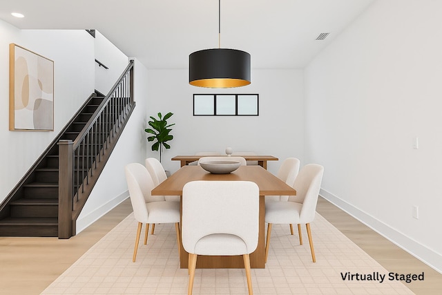 13158 Artisan Cir, Palm Beach Gardens, FL 33418 - dining room with stairs, light wood finished floors, baseboards, and recessed lighting
