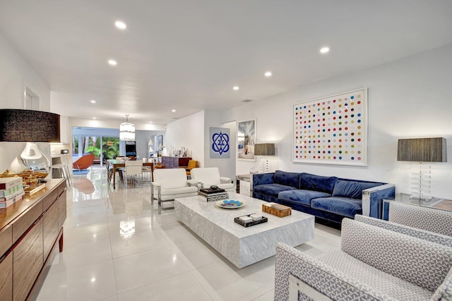 living room with recessed lighting and light tile patterned floors
