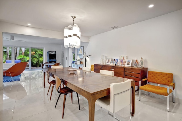 dining room with an inviting chandelier, recessed lighting, and visible vents