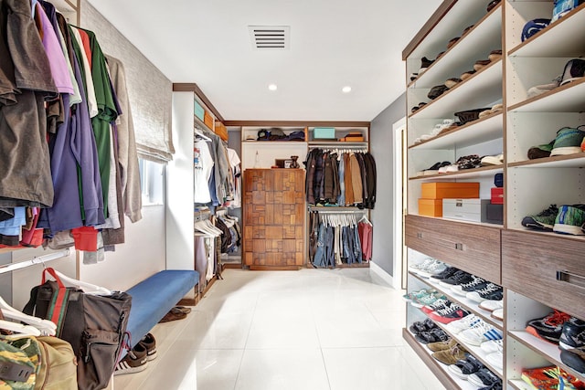spacious closet featuring tile patterned floors and visible vents
