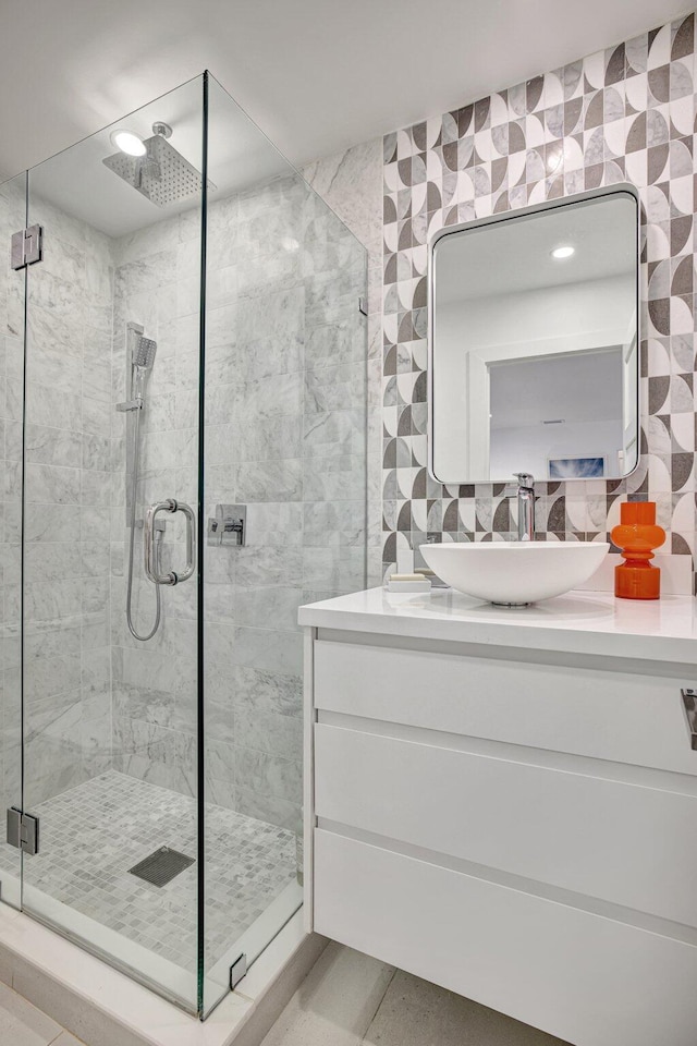 full bathroom with vanity, tile patterned floors, and a stall shower