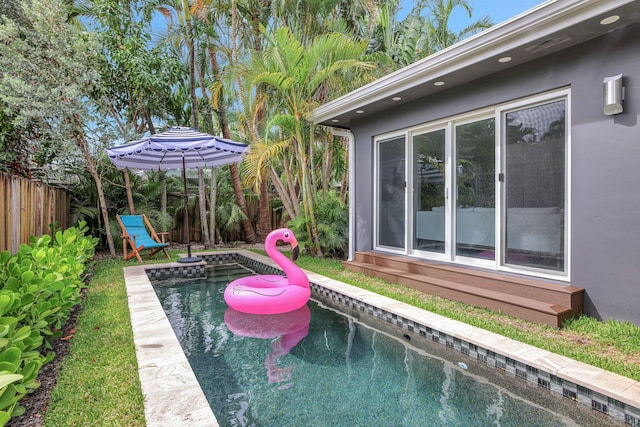 view of swimming pool featuring a fenced in pool and a fenced backyard