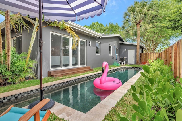 view of pool featuring a fenced in pool and fence