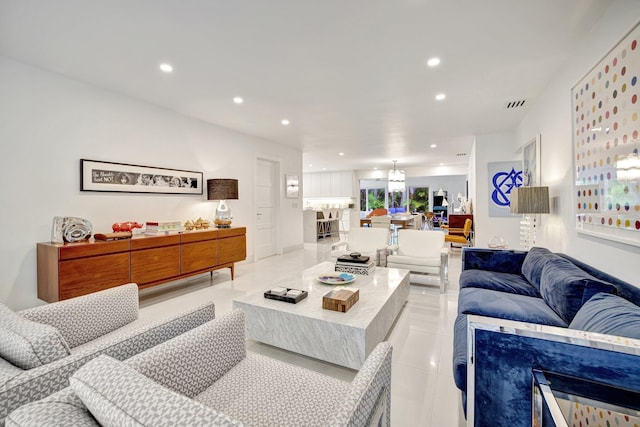 living area featuring visible vents, recessed lighting, light tile patterned floors, and a notable chandelier