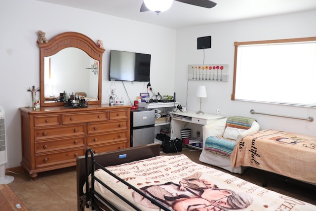 1020 NW 74th Ave, Margate, FL 33063 - bedroom with tile patterned floors, ceiling fan, and freestanding refrigerator