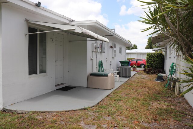 1020 NW 74th Ave, Margate, FL 33063 - view of home's exterior with a patio and central AC unit