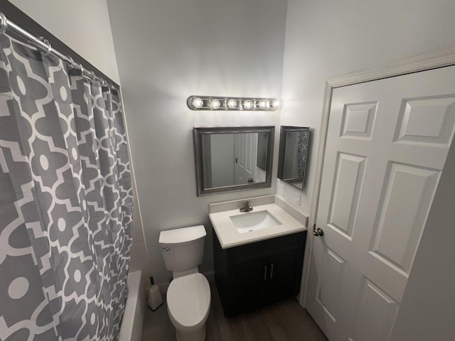 13 Via De Casas Sur Unit 203, Boynton Beach, FL 33426 - bathroom with vanity, curtained shower, toilet, and wood finished floors