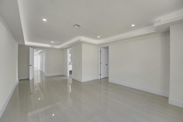 928 Market St, West Palm Beach, FL 33401 - spare room featuring visible vents, light tile patterned floors, a raised ceiling, baseboards, and recessed lighting