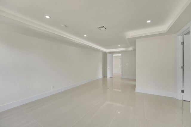 928 Market St, West Palm Beach, FL 33401 - spare room with light tile patterned flooring, recessed lighting, baseboards, a tray ceiling, and visible vents