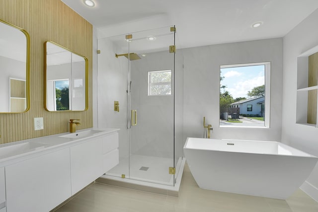 928 Market St, West Palm Beach, FL 33401 - full bathroom featuring double vanity, recessed lighting, a soaking tub, a sink, and a stall shower